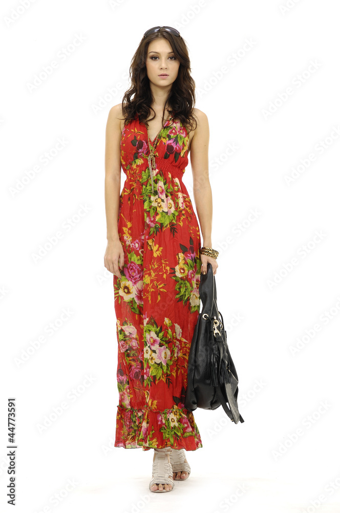 Female mode in evening with handbag at fashion show in studio Female mode in evening with handbag at fashion show in studio