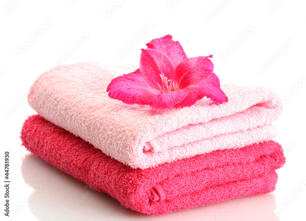 bright towels and flower isolated on white bright towels and flower isolated on white