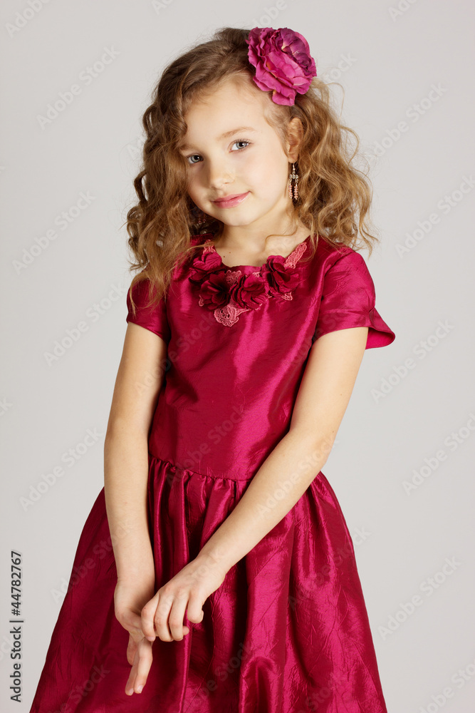 Portrait of little pretty girl in red dress Portrait of little pretty girl in red dress