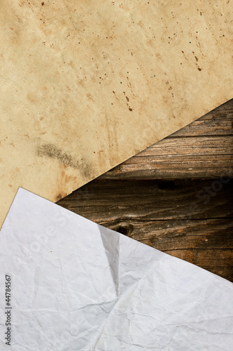 Crumpled papers on a dark wooden background