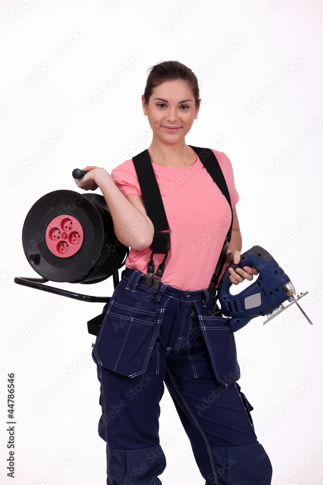 Fototapeta premium craftswoman holding a drill