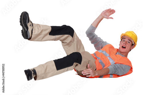Construction worker falling over