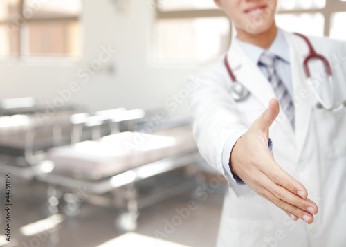 Close up of doctor handshaking in hospital