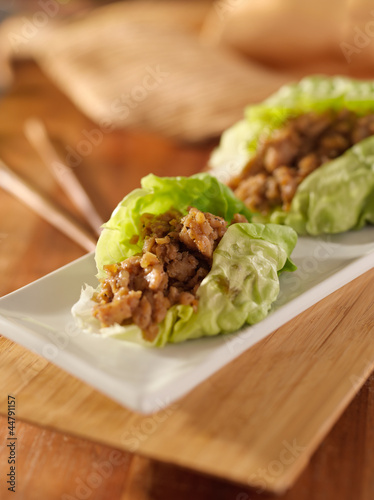 Asian lettuce wrap with minced chicken and seasonings