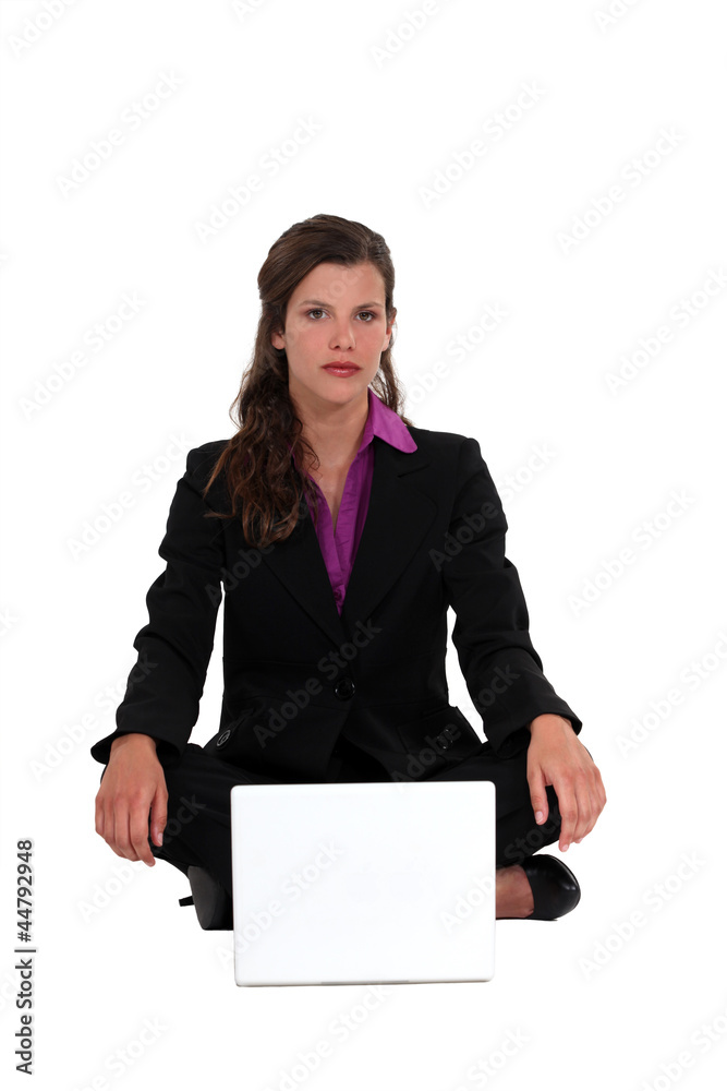 Businesswoman on the floor with notebook Businesswoman on the floor with notebook