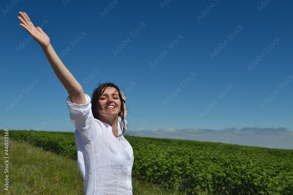 Young happy woman in green field Young happy woman in green field