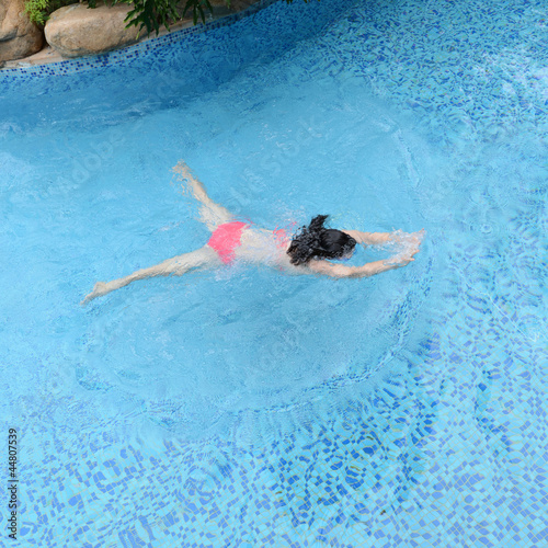 woman diving in a pool