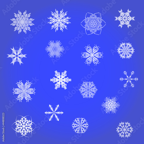 Set of white snowflakes on a dark blue background.