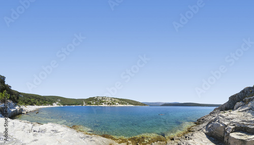 panoramic view of a beautiful rocky beach in croatia, blue sea