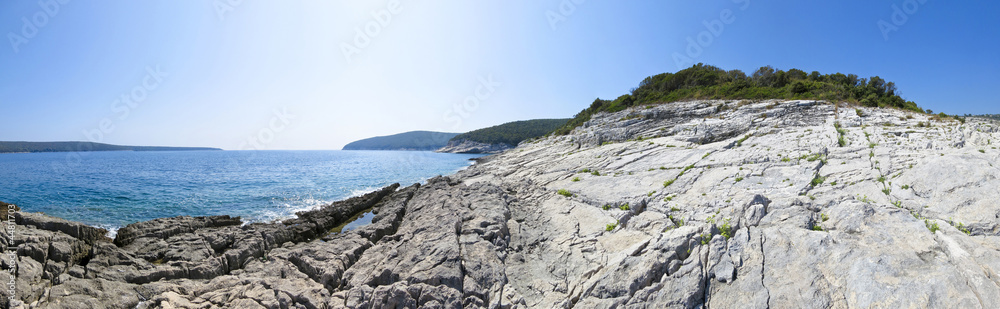 panoramic view of a beautiful rocky beach in croatia, blue sea