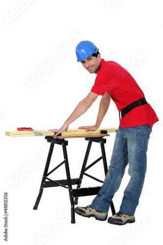Carpenter making a few measurements