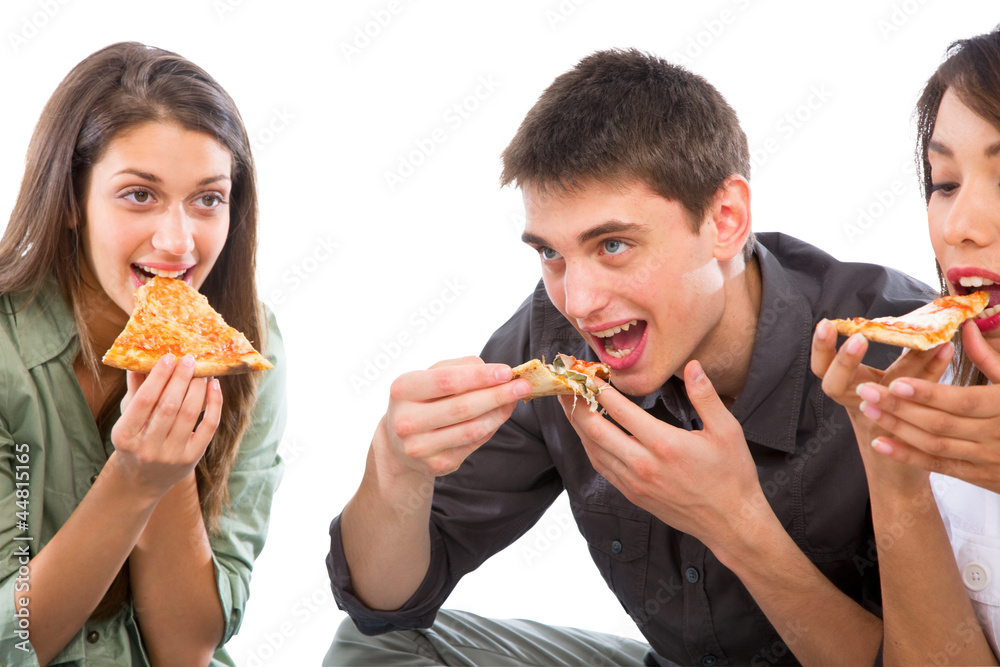 teenagers eating pizza