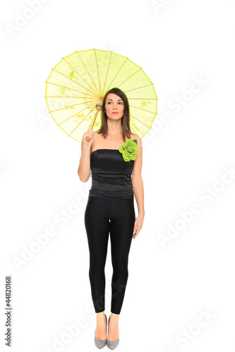 Young women holding a green umbrella