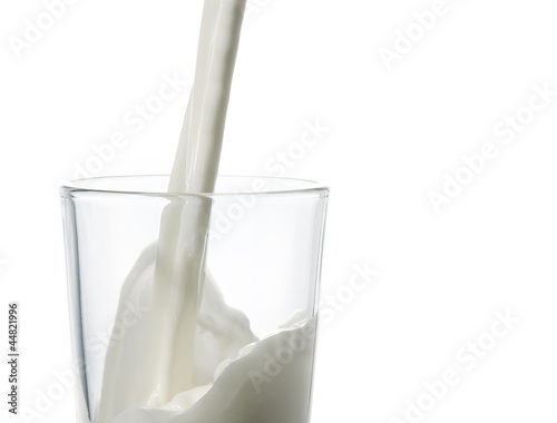 Pouring milk isolated