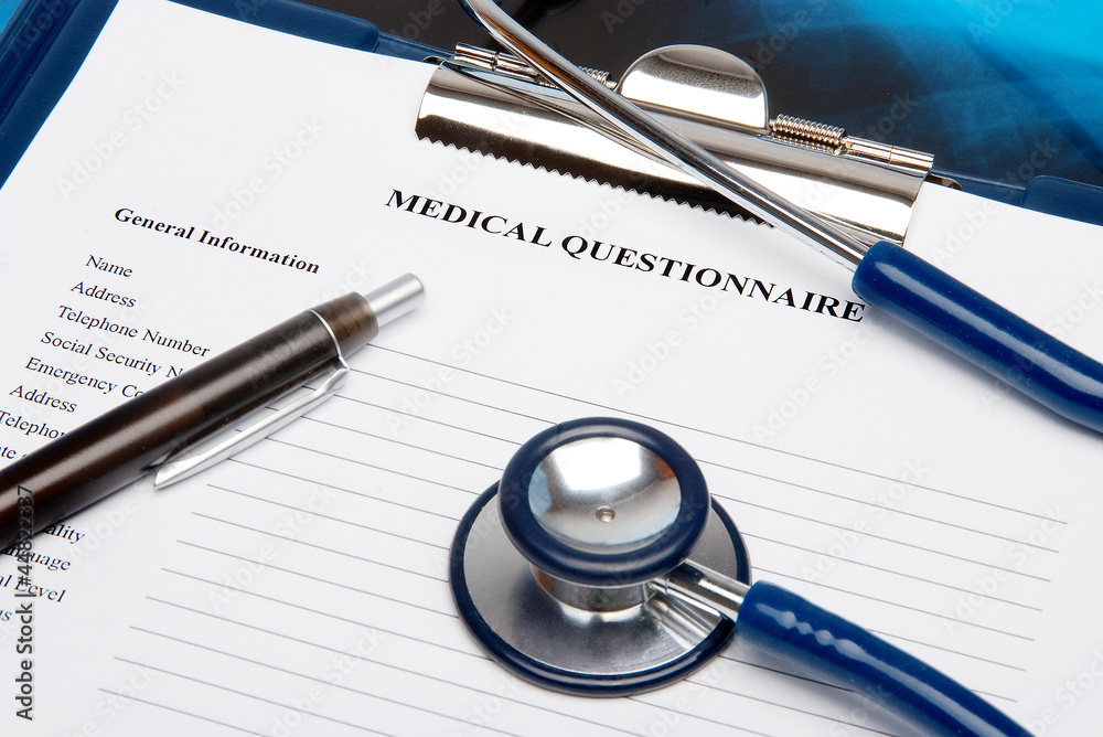 Medical questionnaire in a clipboard with stethoscope