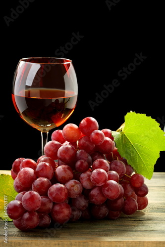 Bunch of grapes and glass of wine.