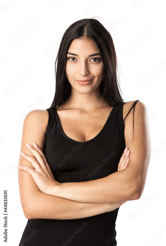 Beautiful young woman standing with her hands folded Beautiful young woman standing with her hands folded