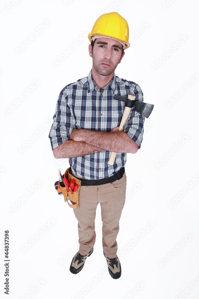Grumpy tradesman holding a hatchet Grumpy tradesman holding a hatchet
