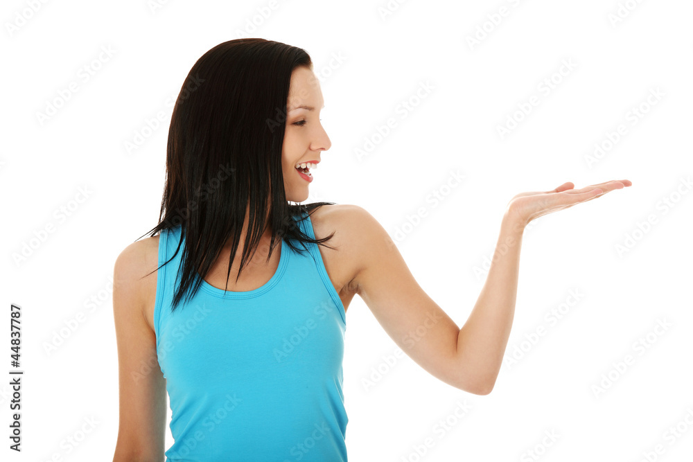 Casual woman presenting something on her heand Casual woman presenting something on her heand