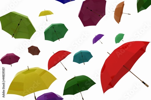 flying of multicoloured umbrellas on a white