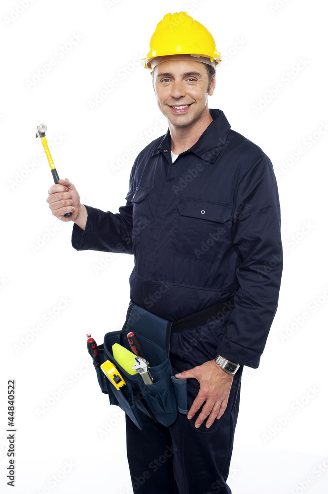 Repairman holding out hammer from his tool kit Repairman holding out hammer from his tool kit