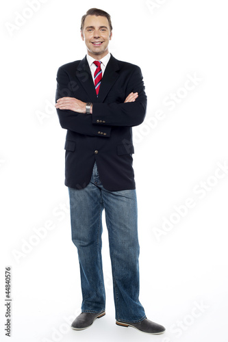 Confident young consultant with his arms crossed