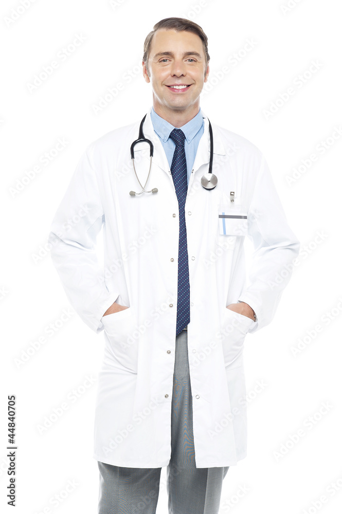 Young doctor posing with hands in his overcoat Young doctor posing with hands in his overcoat