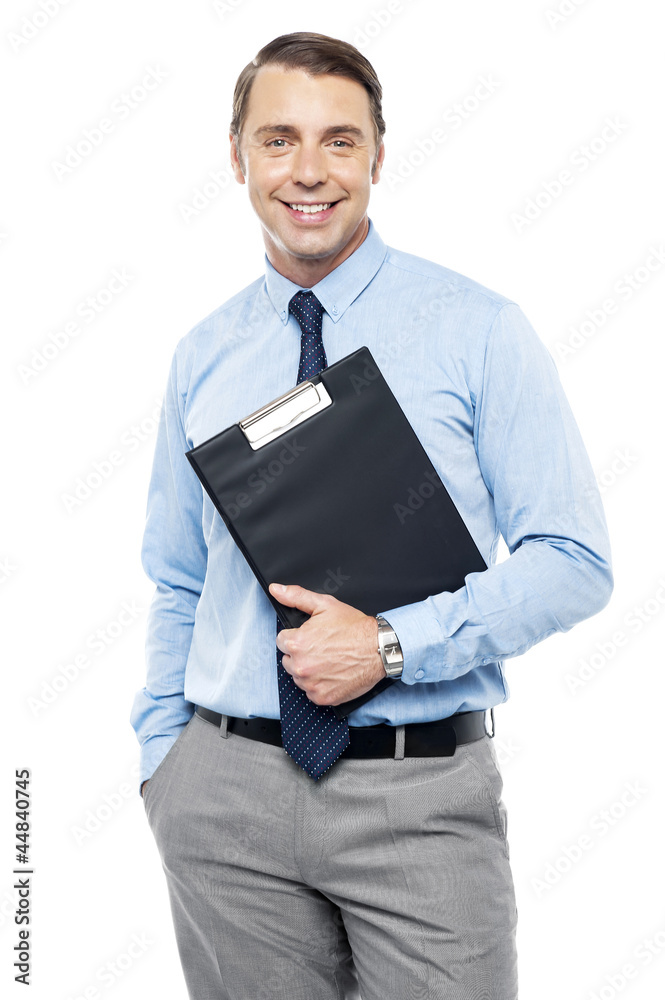 Handsome smiling executive holding clipboard Handsome smiling executive holding clipboard