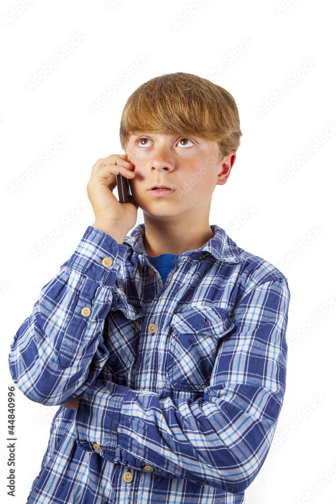 cute handsome young boy speaking a mobile phone cute handsome young boy speaking a mobile phone