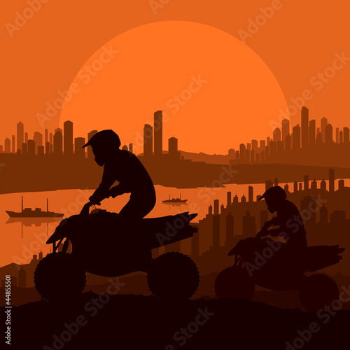 All terrain vehicle motorbike riders in skyscraper city landscap