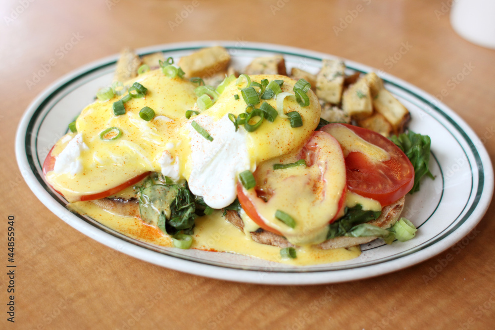 Delicious eggs florentine for breakfast at a restaurant. Delicious eggs florentine for breakfast at a restaurant.