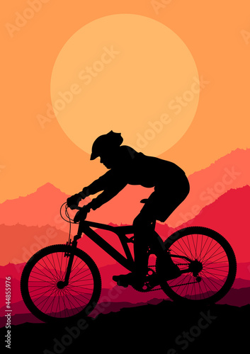 Mountain bike rider in wild mountain nature landscape background