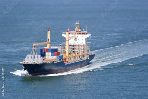 Cargo ship with containers moving