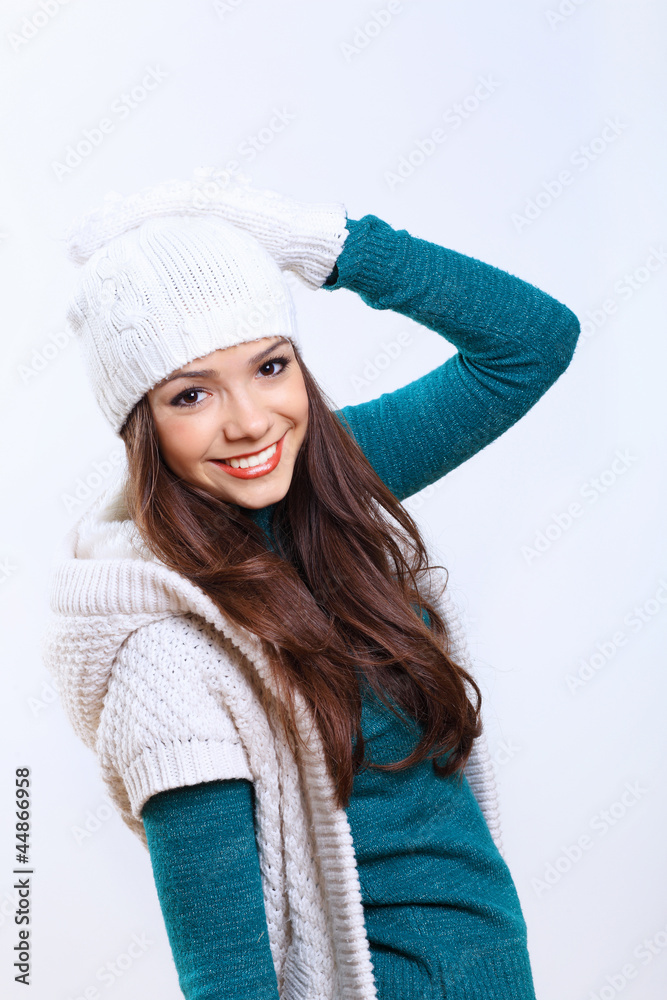 Young woman wearing winter hat and warm scarf