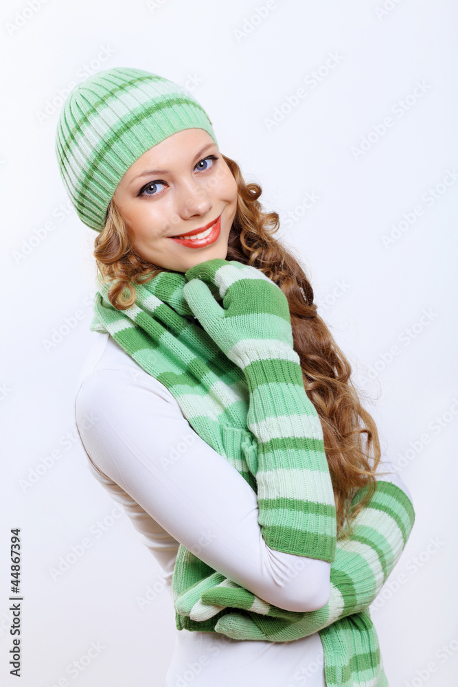 Young woman wearing winter hat and warm scarf Young woman wearing winter hat and warm scarf