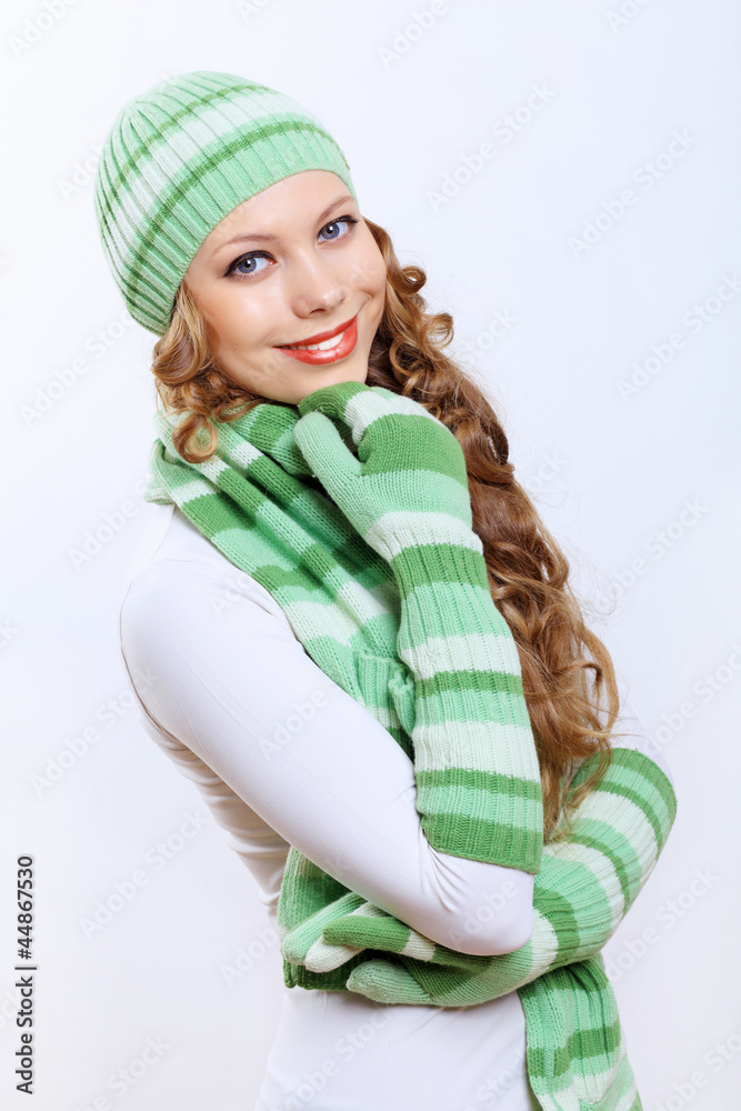 Young woman wearing winter hat and warm scarf Young woman wearing winter hat and warm scarf