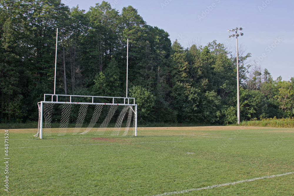 Fototapeta premium A view of the goal on a vacant soccer pitch..
