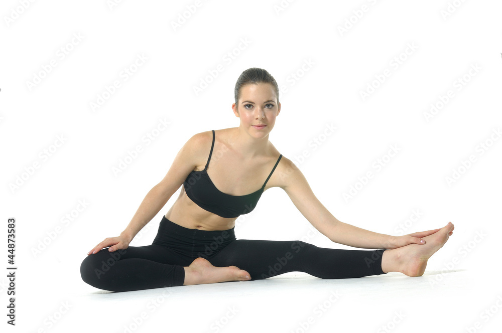 Girl doing yoga on white