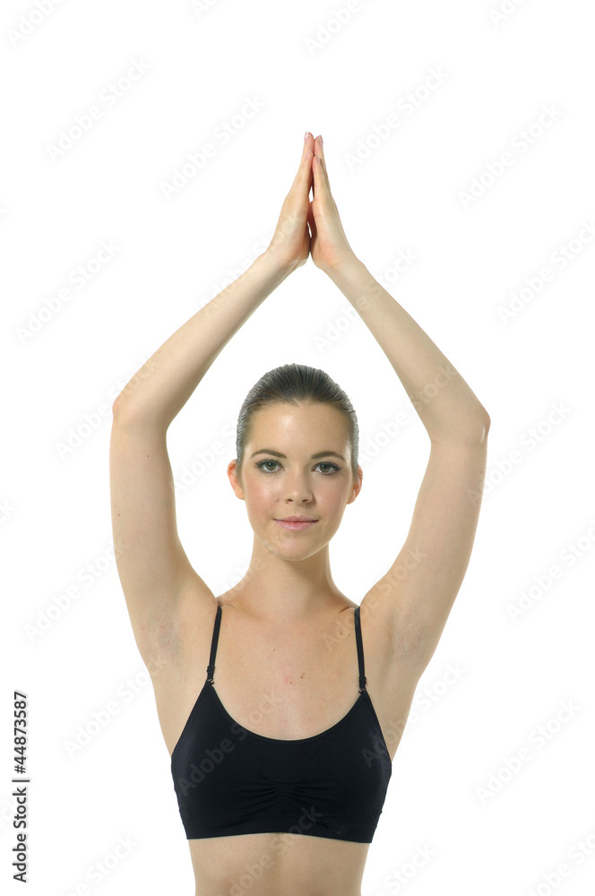 Girl doing yoga moves or meditating on white Girl doing yoga moves or meditating on white