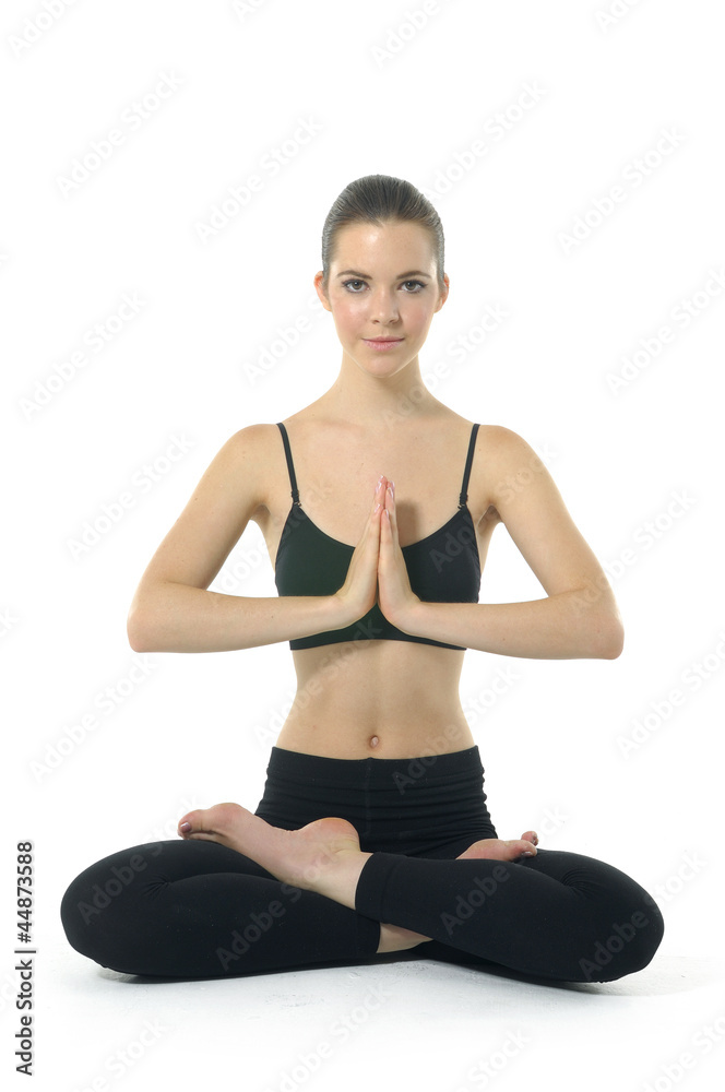 Young woman doing yoga exercise