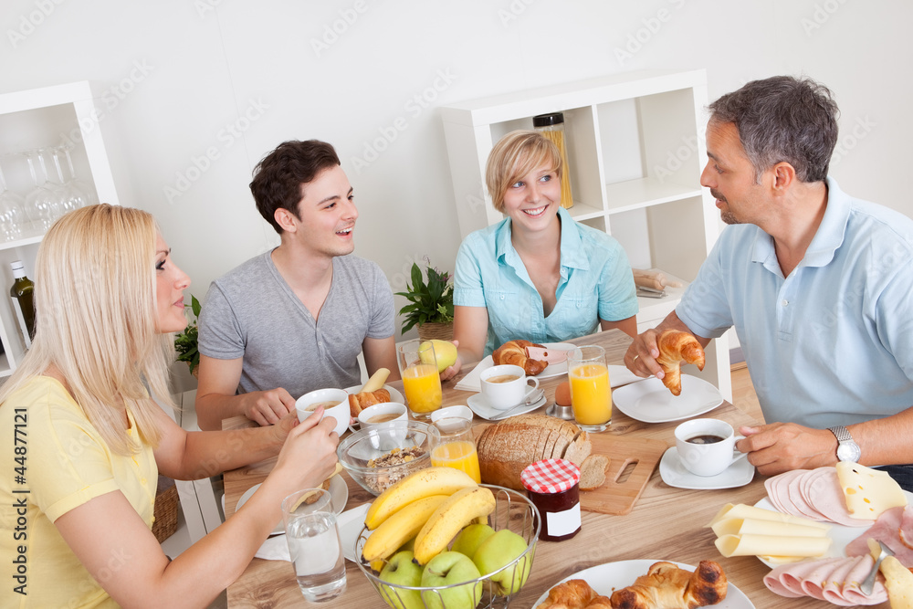 Happy family enjoying breakfast Happy family enjoying breakfast