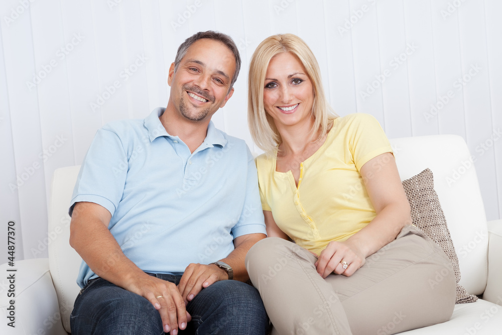 Loving couple relaxing on a sofa Loving couple relaxing on a sofa