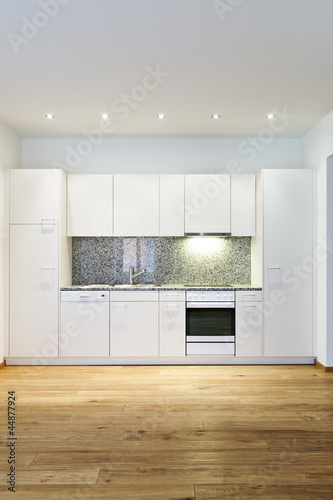 interior empty house with wooden floor, kitchen