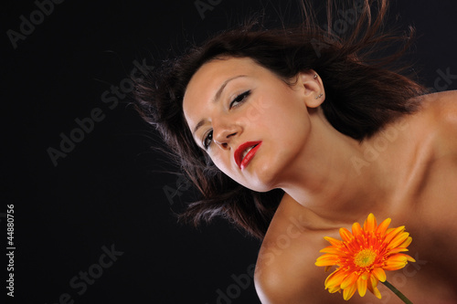 Beautiful woman with great mood orange flower photo