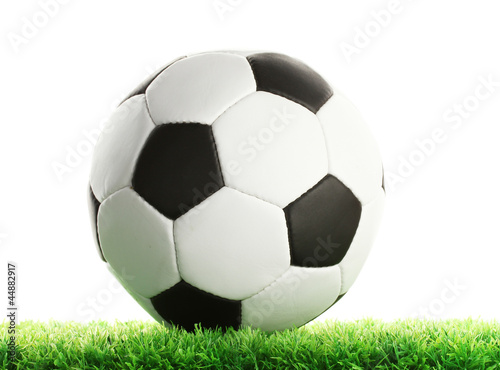 football ball on green grass  isolated on white