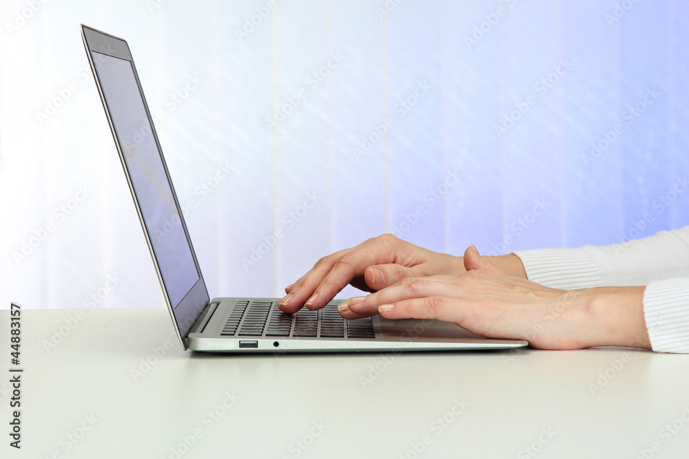 Closeup of businesswoman hands typing on laptop computer Closeup of businesswoman hands typing on laptop computer