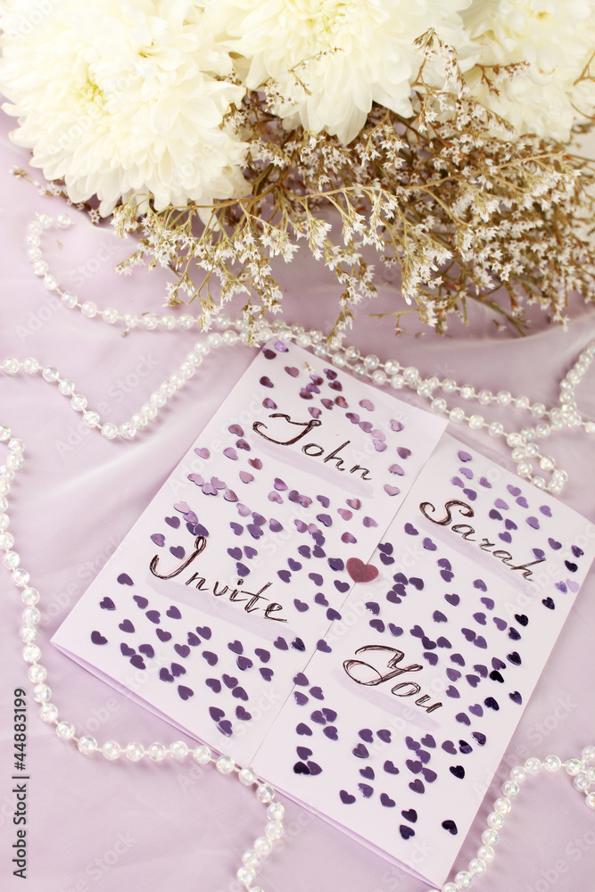 wedding invitations on decorated table close-up wedding invitations on decorated table close-up