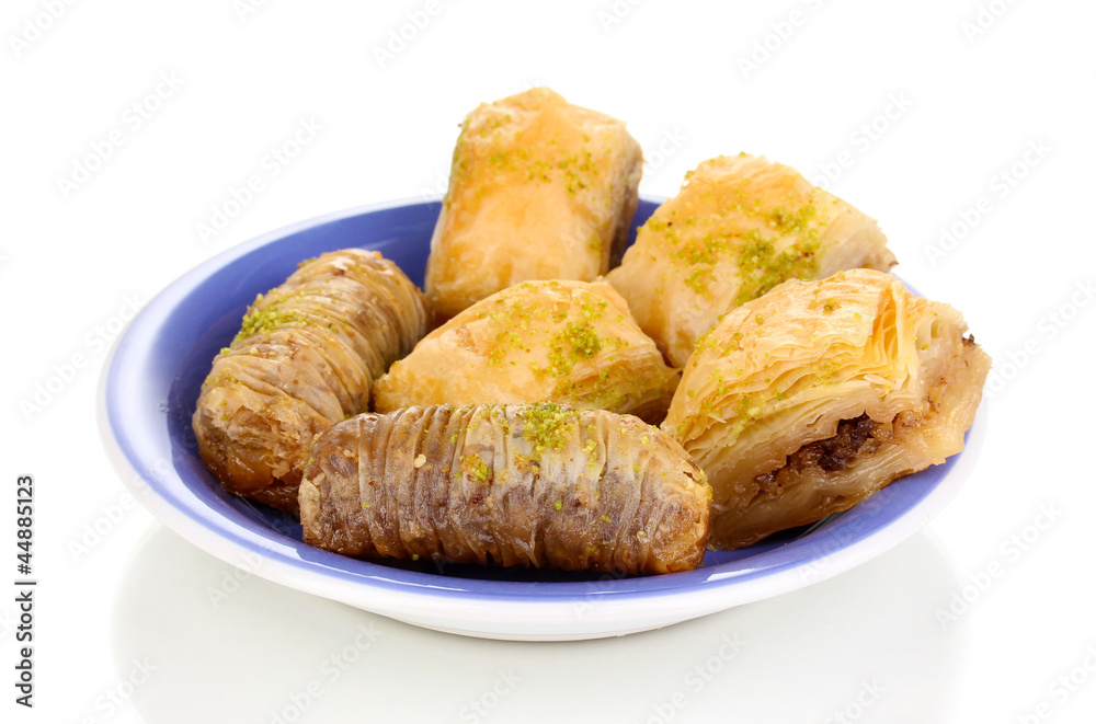 Sweet baklava on plate isolated on white Sweet baklava on plate isolated on white