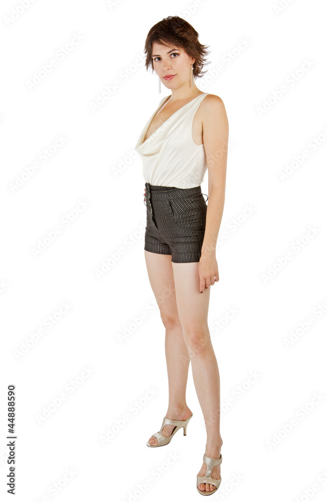 Glamorous sexy young woman stands up straight with shoulders bac Glamorous sexy young woman stands up straight with shoulders bac