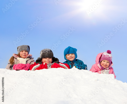 Happy children in winter park photo